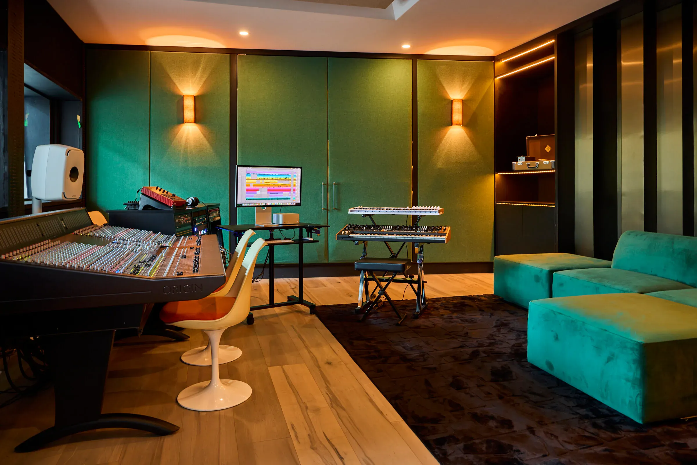 Verdant Sound control room — SSL Origin console, Genelec 8351B monitors, green velvet walls