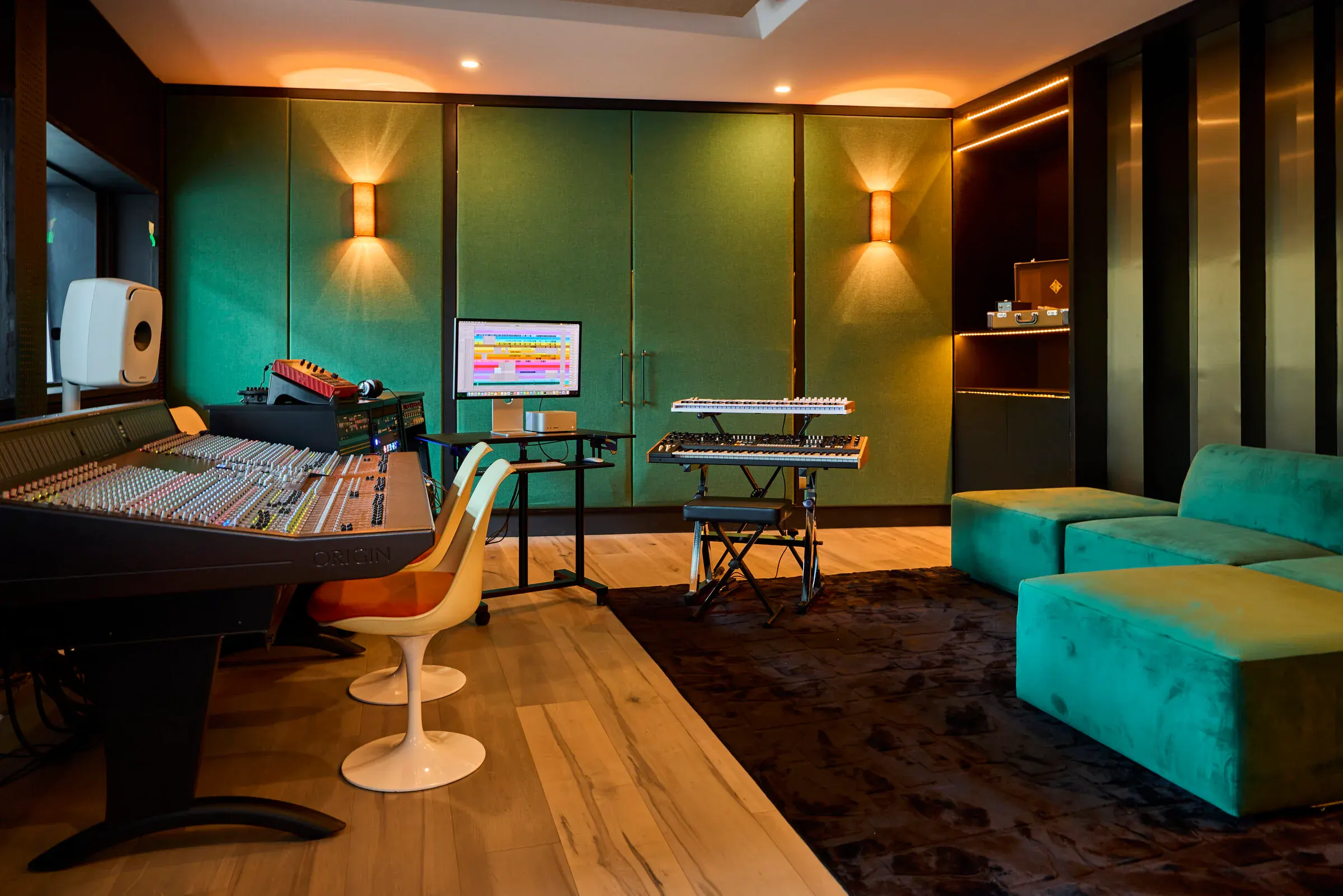 Verdant Sound control room — SSL Origin console, Genelec 8351B monitors, green velvet walls